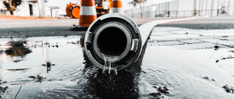 water coming out from gray pipe